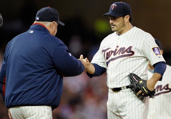 Minnesota Twins pitcher Sidney Ponson winds up to throw out Boston