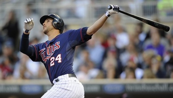 Trevor Plouffe of the Minnesota Twins looks on and points at the